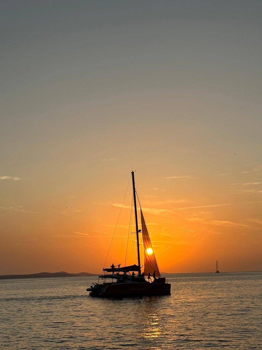 Collage of sunset and ocean scenes featuring a sailboat, vibrant beach, and cloudy horizon, showcasing serene travel moments.